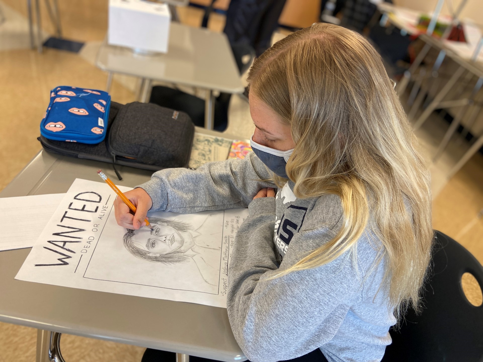 A student works on a class project. 