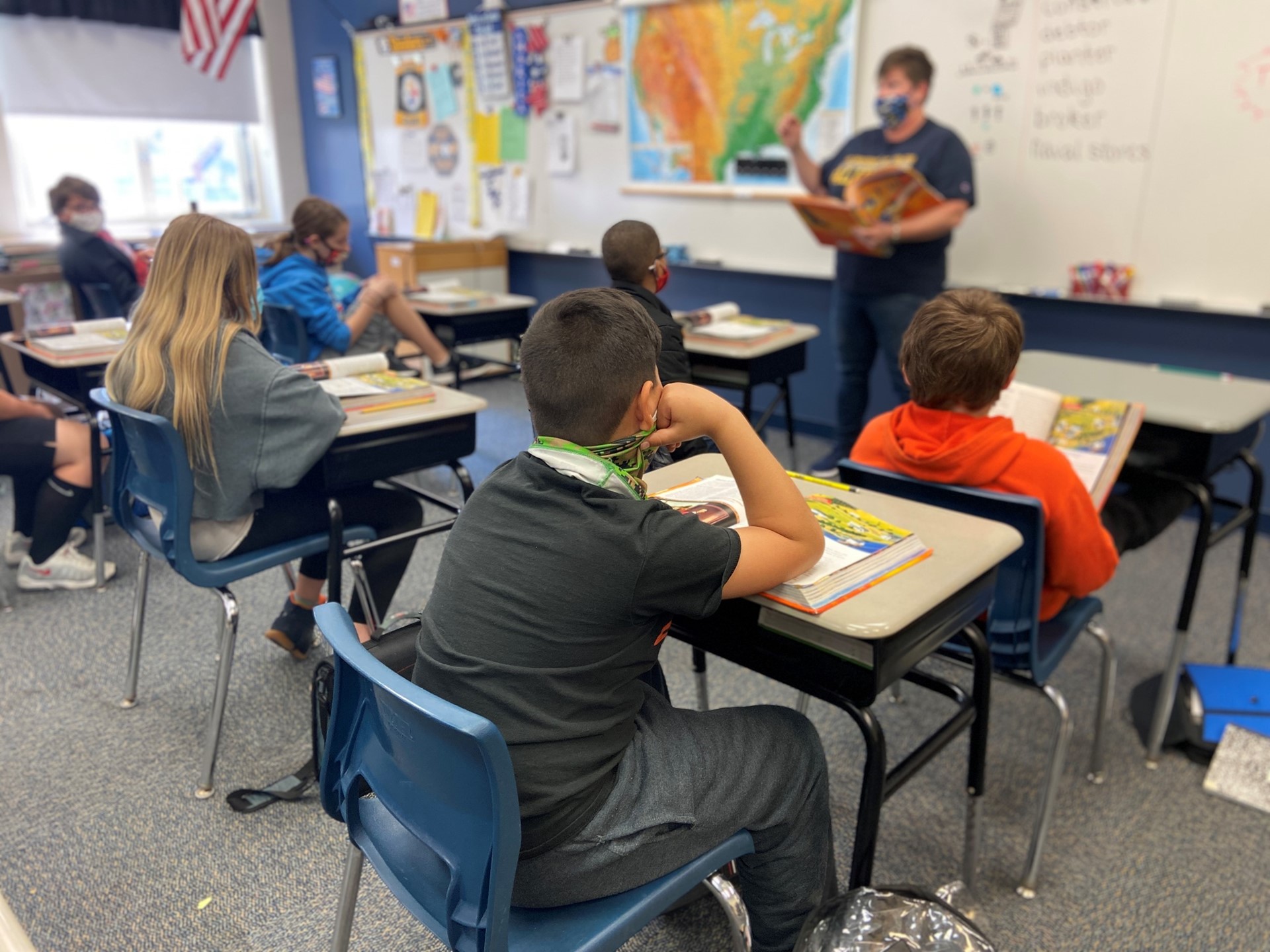 Students listen to Mrs. Grant give the social studies lesson. 