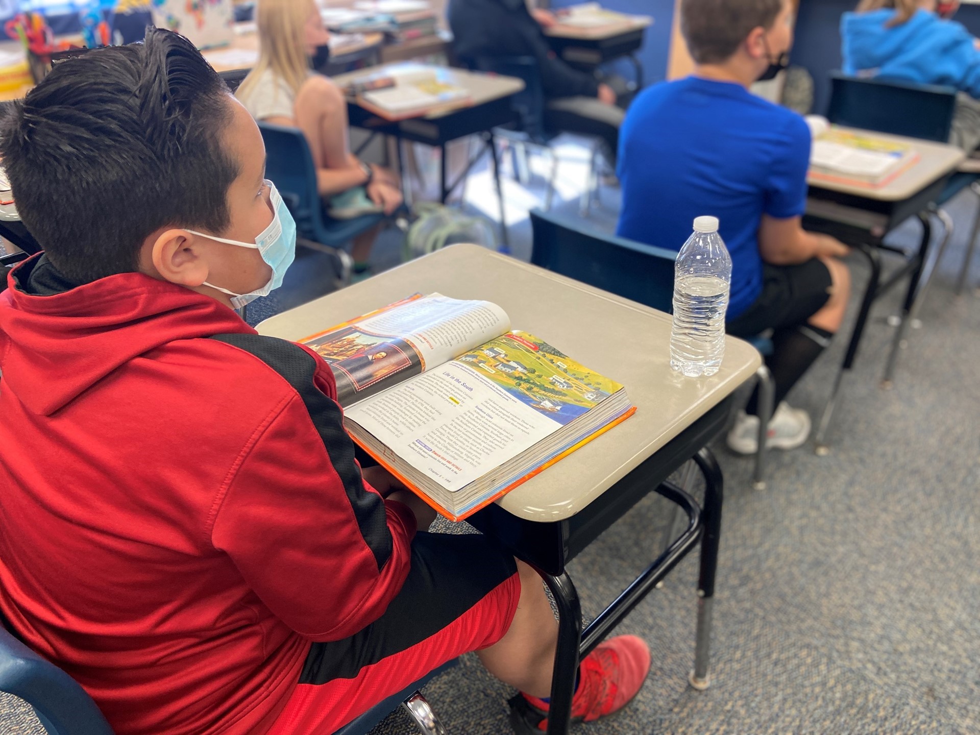 A student focuses on his social studies lesson. 