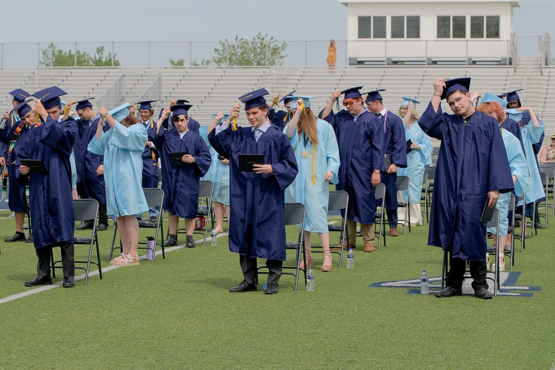 Graduates move their tassals. 