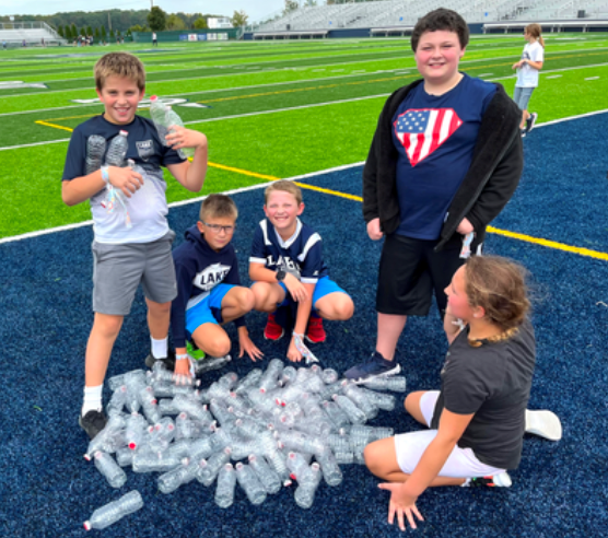 Students play gold rush on the football field. 