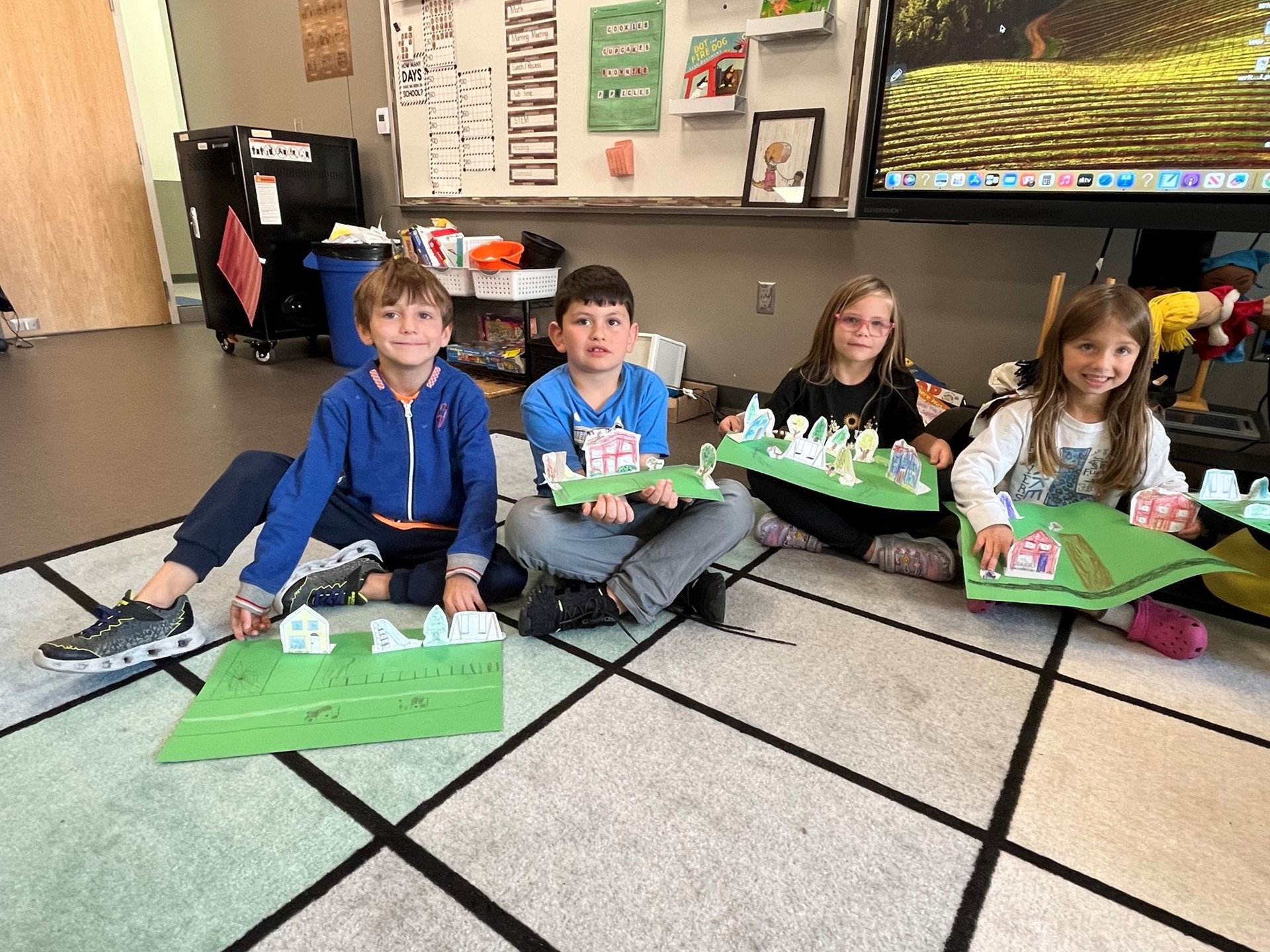 Students display their pop up community displays in 1st grade. 
