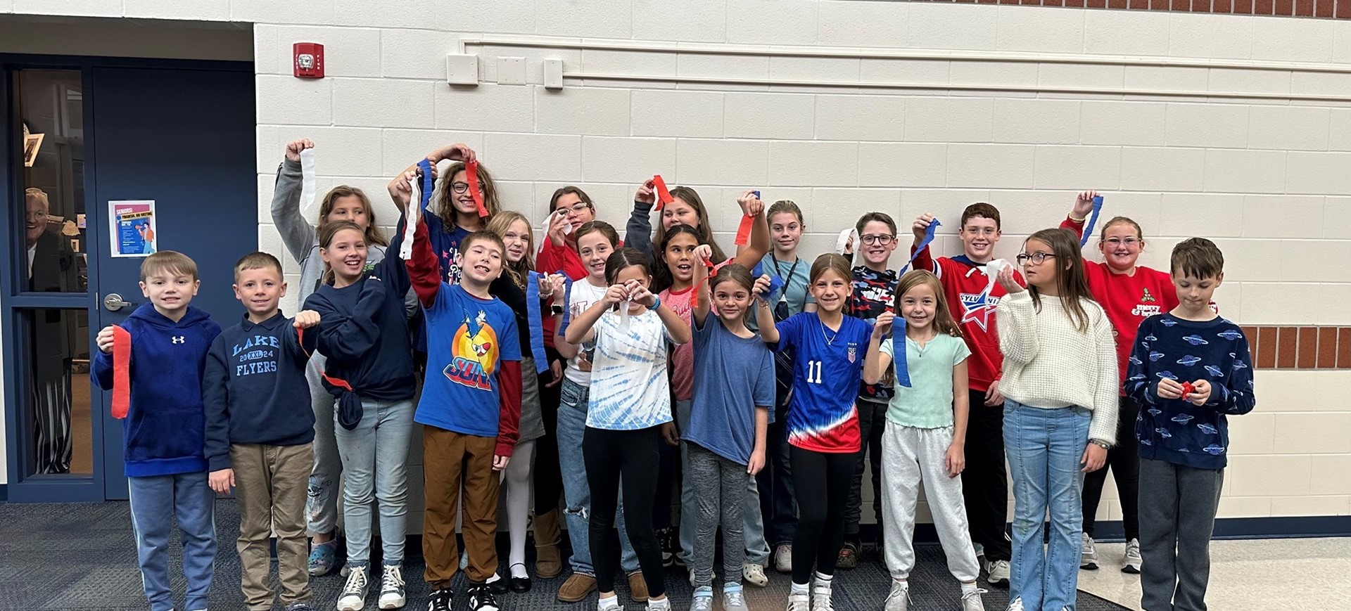Elementary student council members greet Veterans at the breakfast. 