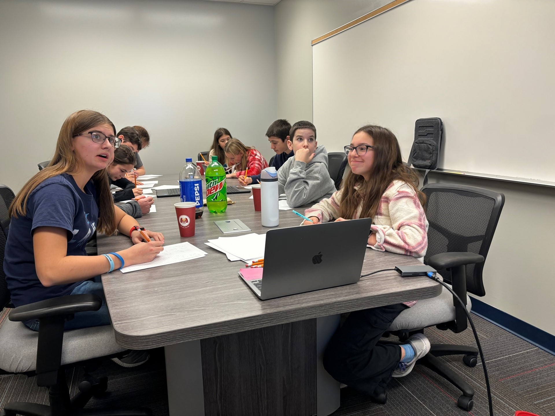 Middle School math club students compete in a math competition. 